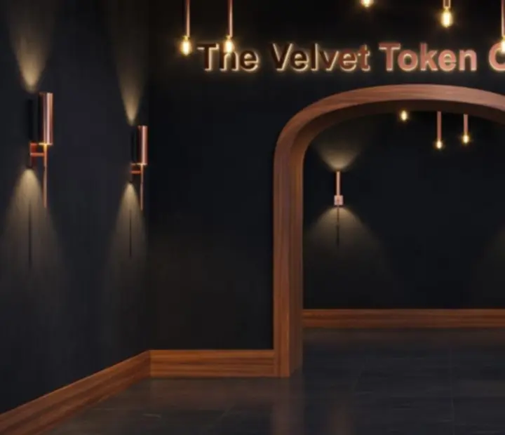 Entrance to The Velvet Token Card Lounge with dark walnut finishes and ambient evening lighting.